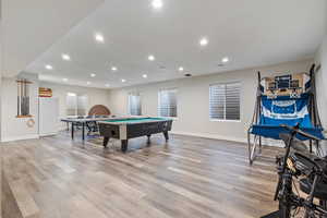 Recreation room featuring light wood-type flooring and pool table