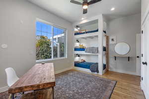 Bedroom featuring light wood-type flooring and ceiling fan