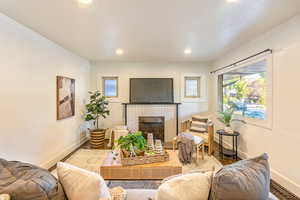 Main level living room featuring a fireplace