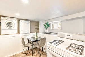 Basement apartment kitchen/dining area, gas range and washer and dryer