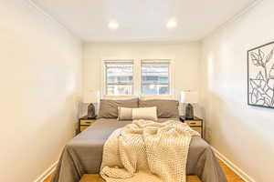 Main level bedroom #2 with light bamboo flooring