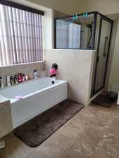 Bathroom featuring plus walk in shower