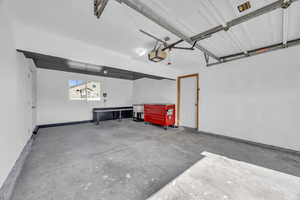 Garage featuring a garage door opener