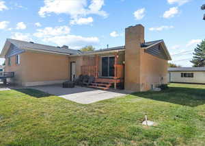 New cedar covered porch adjacent to concrete patio with sliding glass door leading to upper level family room. Also, exterior entrance with access to mud room.