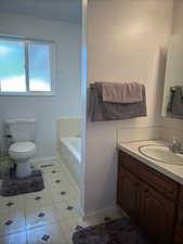 Upper level second bathroom down the hallway from bedrooms and living room.