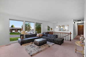 View from the livingroom overlooking the foyer and hallthat leads to three main level bedrooms.