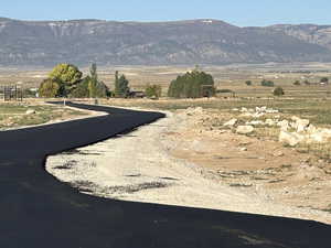 Property view of mountains with a rural view