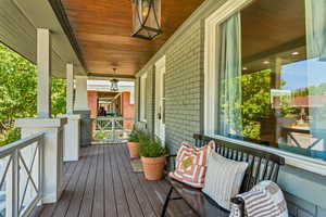 Wooden terrace featuring covered porch