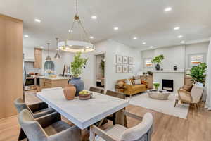 Dining area with light hardwood / wood-style flooring