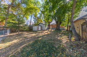 View of yard with a storage shed