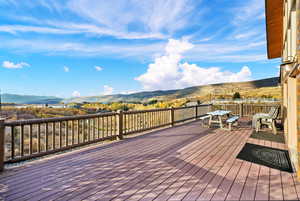 Wooden terrace featuring a mountain view