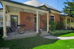 View of front of house featuring a front yard and covered porch