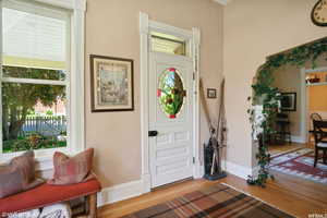 Foyer entrance with wood-type flooring