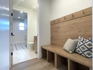 Mudroom with light hardwood / wood-style flooring