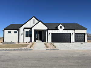 Modern farmhouse featuring a garage