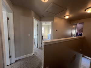 Upstairs Hall with light colored carpet