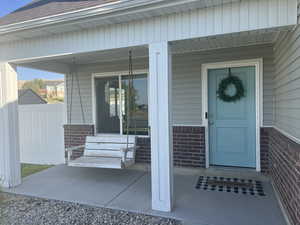 View of the covered porch and the included Porch Swing.