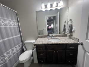 Hall full Bathroom on 2nd floor with granite countertops and tiled floors