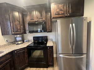 Black and stainless steel appliances