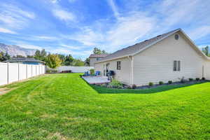 Fully fenced and landscaped yard with two gate access points