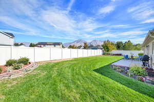 Fully fenced and landscaped yard with two gate access points