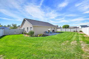 Fully fenced and landscaped yard with two gate access points