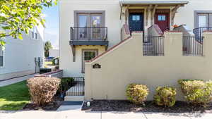 View of front of home with a balcony