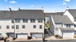 Exterior space featuring cooling unit and a garage