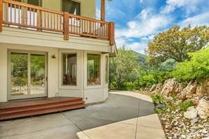 View of patio featuring a mountain view and a balcony