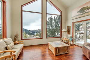 Sunroom / solarium with vaulted ceiling and a mountain view