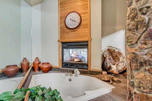 Bathroom with tiled tub