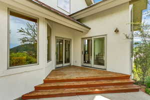 Doorway to property featuring a deck