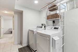 Nice space with beautiful marble tile in laundry area, with additional storage as well!