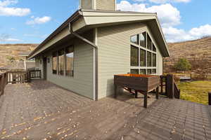 View of home's exterior featuring a wooden deck