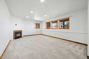 Unfurnished living room with carpet floors