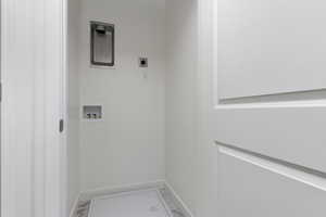 Washroom with washer hookup and electric dryer hookup