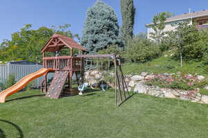 View of playground with a lawn