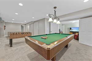 Playroom featuring light carpet and pool table