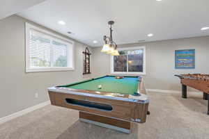 Playroom featuring light carpet and pool table