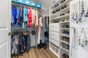 Walk in closet featuring hardwood / wood-style flooring