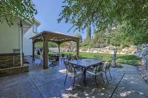 View of patio featuring a gazebo