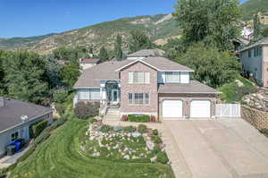 View of front facade featuring a mountain view and a garage