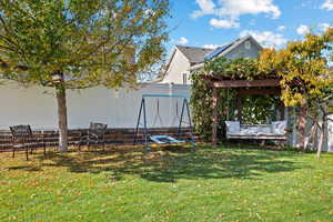 View of yard featuring a pergola