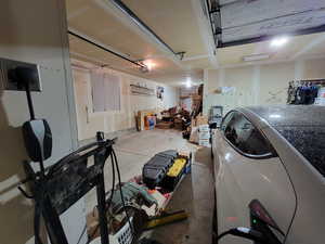 Garage featuring a garage door opener