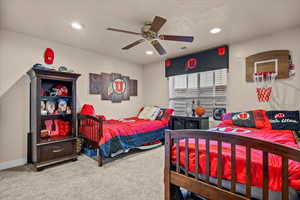 Bedroom featuring carpet and ceiling fan