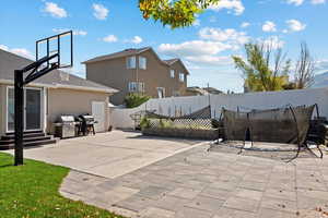 View of patio / terrace featuring a trampoline and a grill