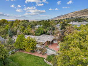 Birds eye view of property with a mountain view