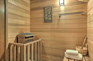 View of sauna / steam room featuring wooden walls