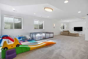 Playroom featuring light colored carpet