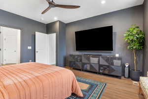 Bedroom featuring light wood-type flooring and ceiling fan